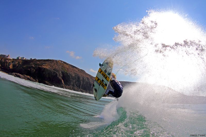 Surfing busting an air in glorious summer weather